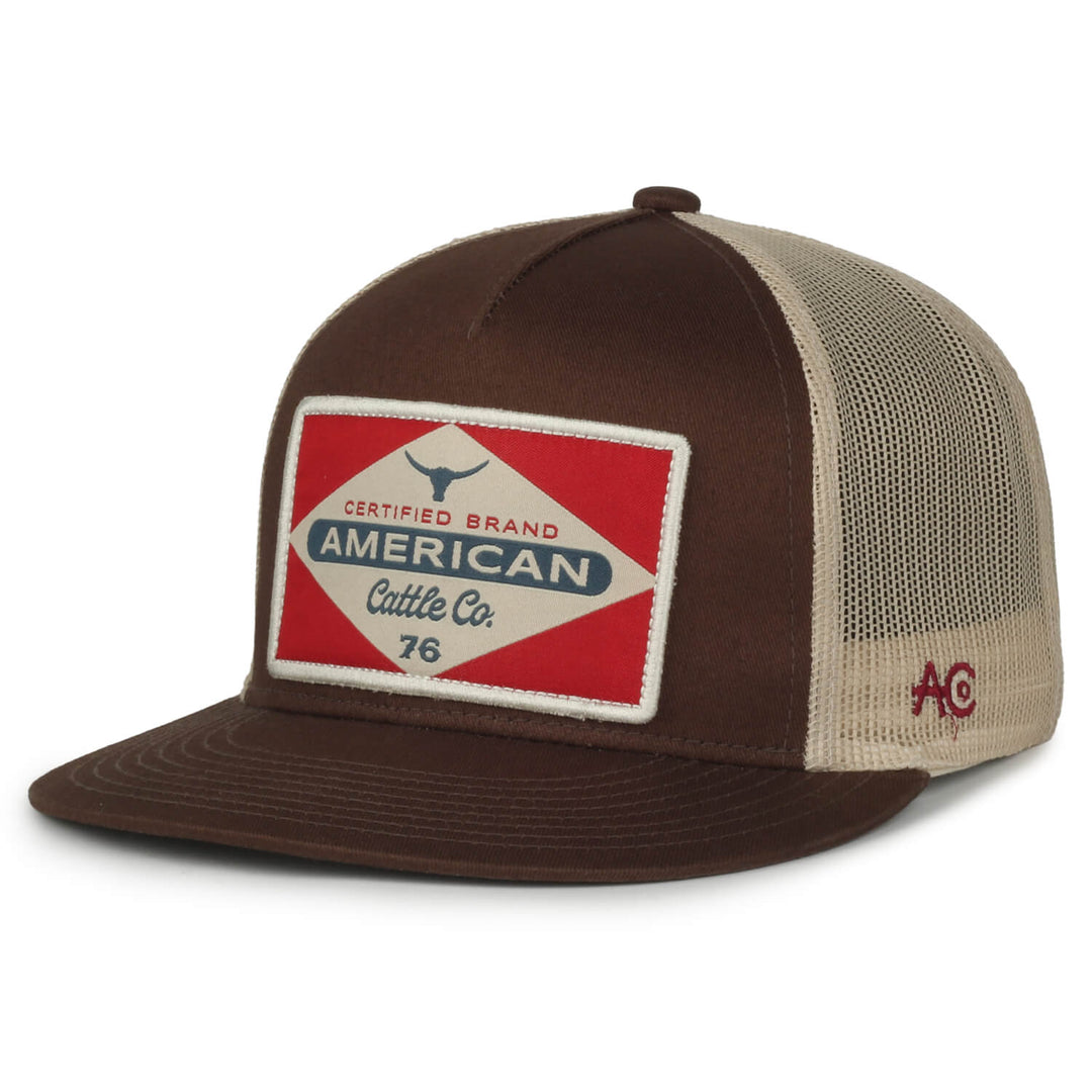 The Billboard Hat-Flat, model BB-F01, is a brown and beige trucker-style cap with a breathable mesh back, making it ideal for any rancher. The front sports a patriotic red, white, and blue patch that reads "Certified Brand American Cattle Co. 76" alongside a small bull head image. Additionally, the side is embroidered with the AC Co. logo in red, underscoring the premium quality of American Cattle Co. products.