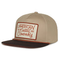 The Billboard Script Hat by 253408 boasts a beige and brown design with a flat brim. Its front panel patch reads 