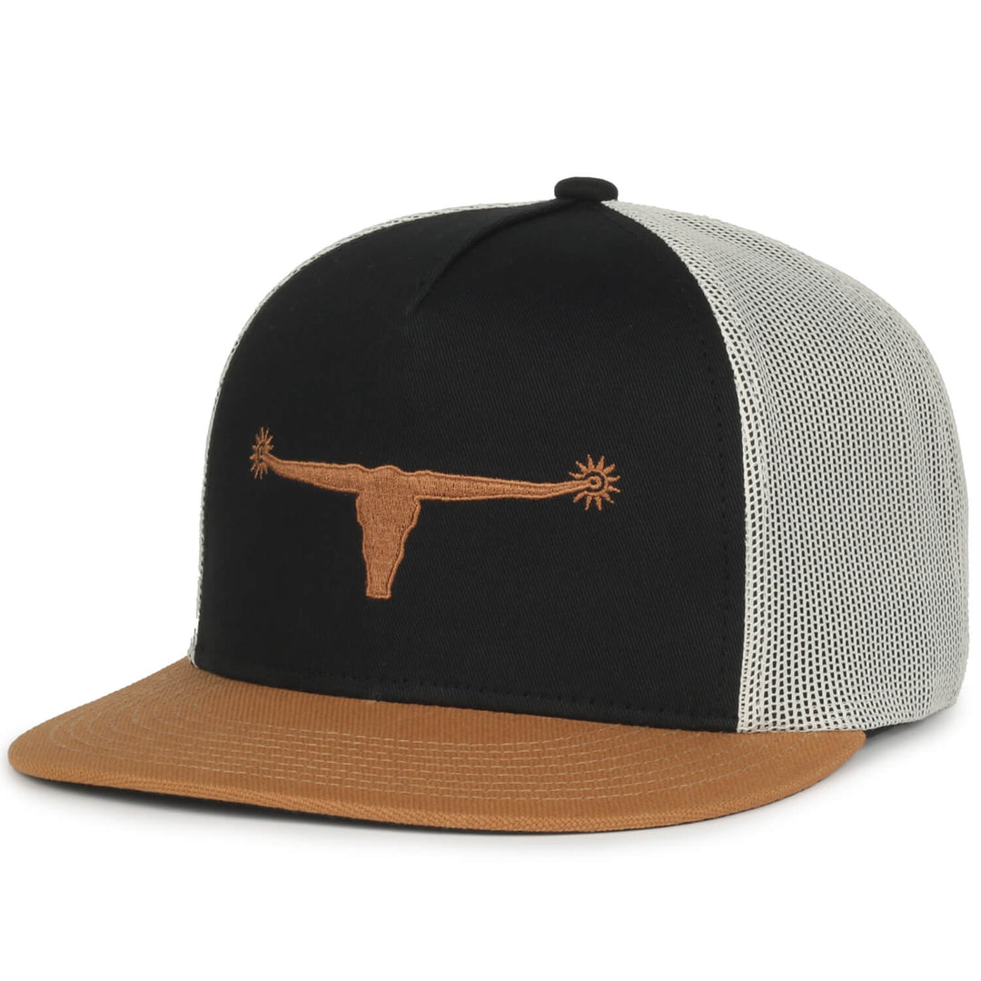 Introducing the Bull Spurs Icon Hat by Rural Cloth: a breathable mesh hat in black and putty, featuring a brown embroidered longhorn skull with spurs on the horns, perfectly capturing rural American style.