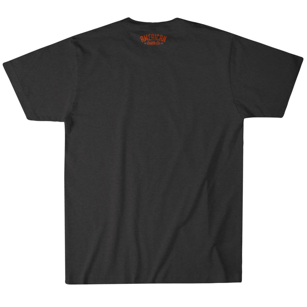 A black short-sleeved Bull Spurs Icon Tee from Rural Cloth is shown from the back. It features a plain fabric with no patterns, a subtle Bull Spurs Icon for rugged charm, and "American Classic Co." in small orange text near the neckline.