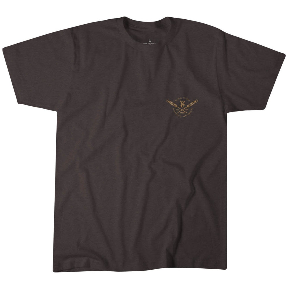 The Rural Cloth Cluck Cluck Boom Tee is a plain dark brown T-shirt made from super soft cotton, featuring a small light brown logo of crossed tools and a laurel wreath encircling "DC" on the left chest. Made in the USA, it's displayed flat on a white background.