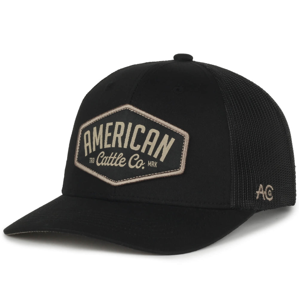 Introducing the Diamond Hat by Rural Cloth: This black baseball cap showcases a front patch embroidered with "AMERICAN Cattle Co." in striking white letters. Celebrate American heritage with its mesh back and subtle "AC" logo on the side, making it an exceptional example of diamond hat craftsmanship.