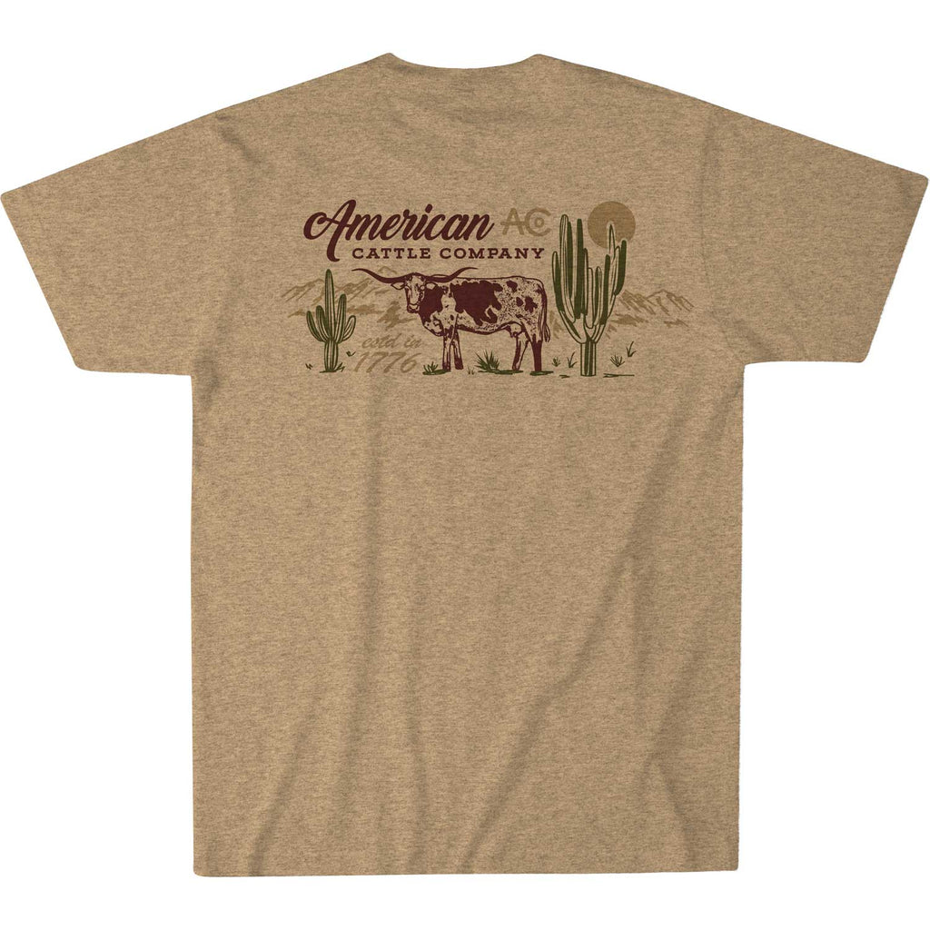 Gold Heather Shadowhorn Tee by Rural Cloth featuring a longhorn silhouette, a cow with cacti, and a sun backdrop. The text reads 