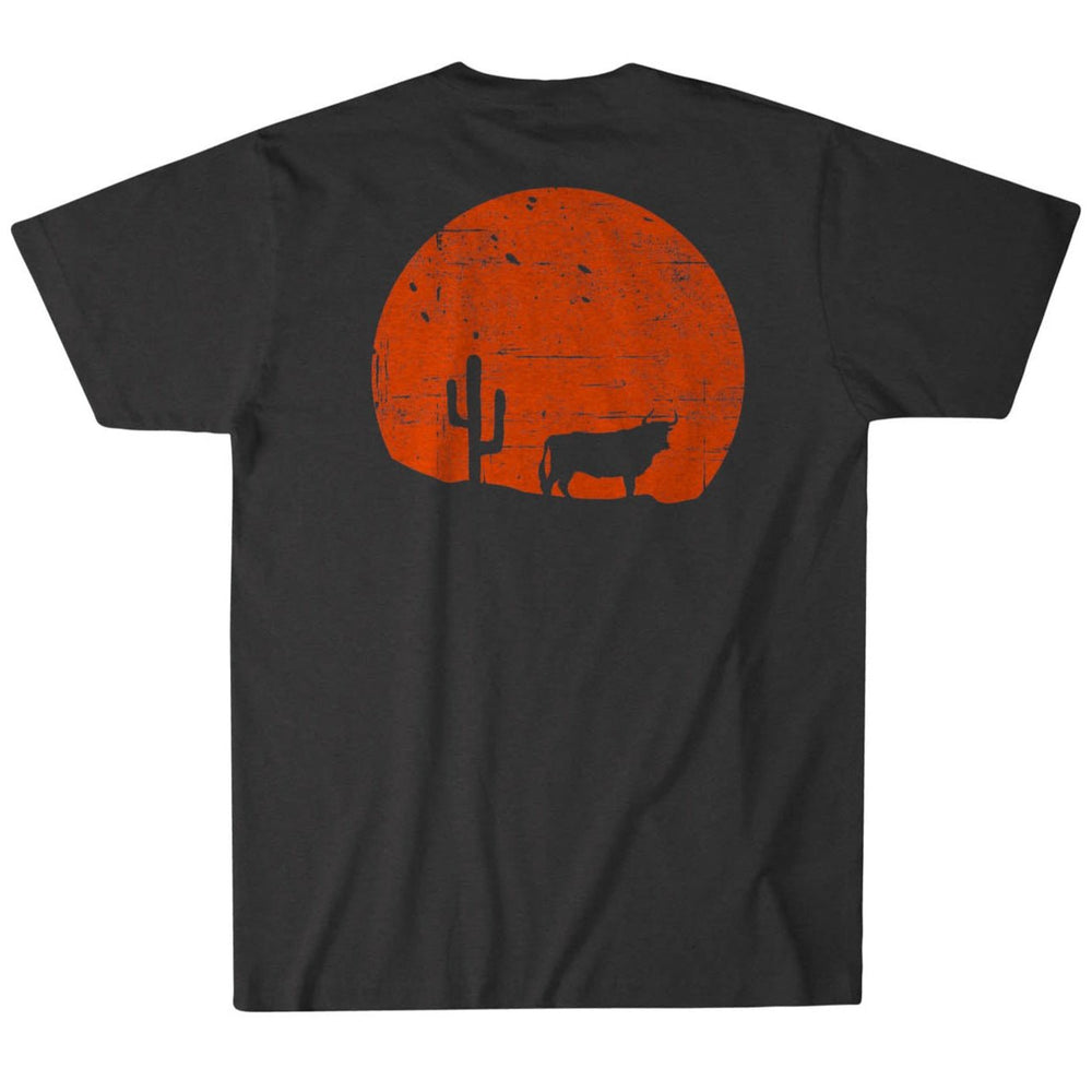 The Rural Cloth Sunset Tee is a black T-shirt featuring a graphic of an orange Western sunset with a cactus and cow silhouette, crafted in a contemporary fit from premium weight fabric for ultimate comfort.