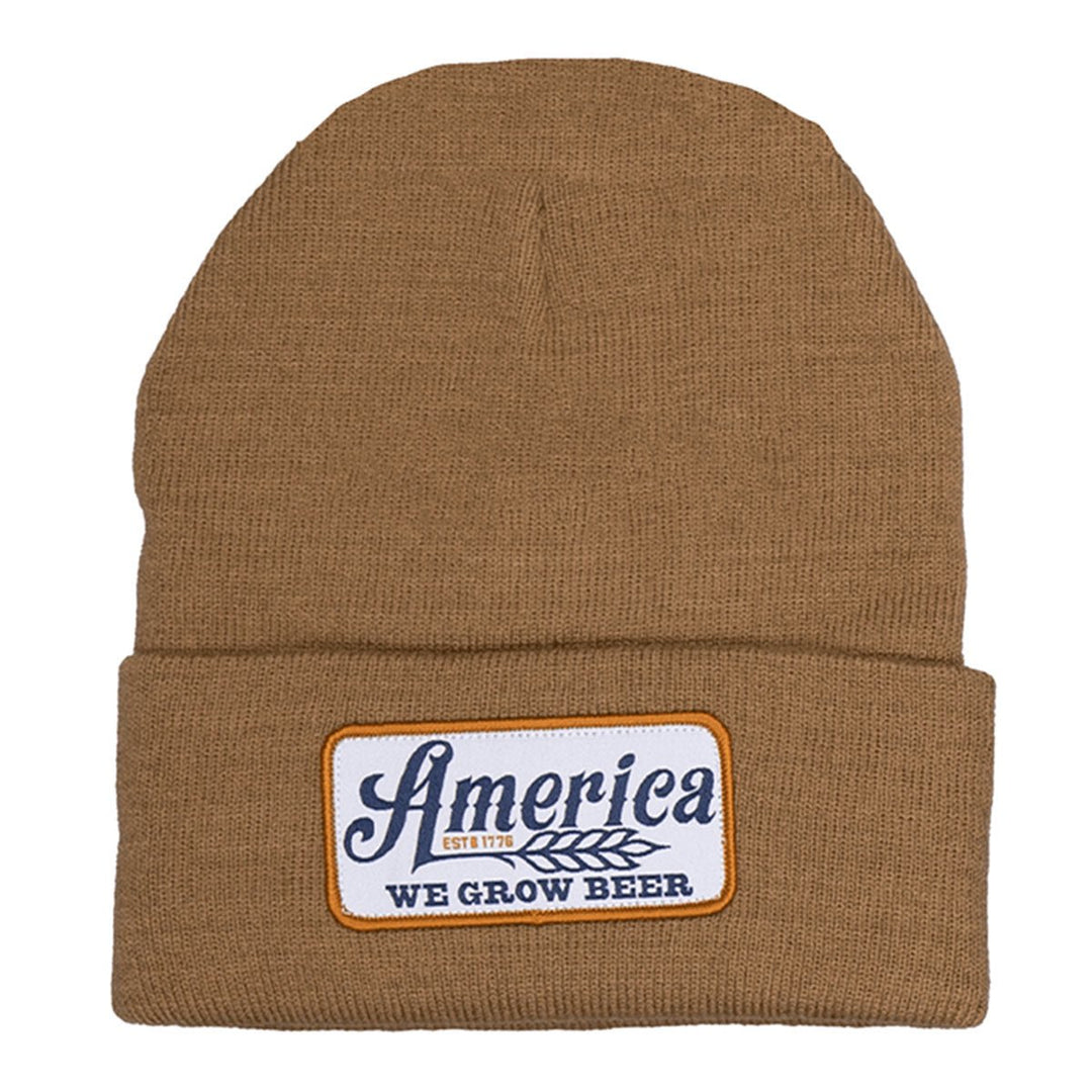 The We Grow Beer Beanie by Rural Cloth is a cozy barn-colored accessory featuring a front patch that proudly declares "America Est. 1776 We Grow Beer," celebrating America's favorite beverage with style and warmth.