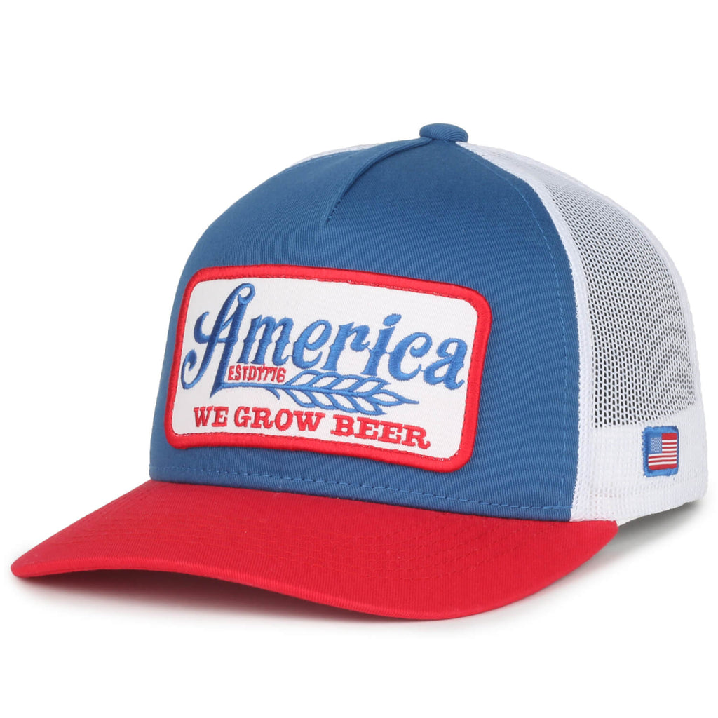 The Rural Cloth We Grow Beer Hat-Red, White and Blue is a stylish mesh baseball cap featuring a front patch with the text 