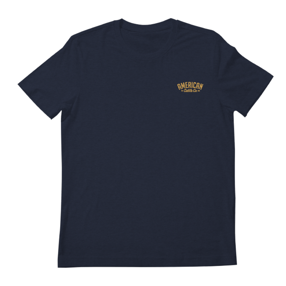 A navy blue Bronco TM Tee by Rural Cloth with a small yellow design on the left chest area that reads "AMERICAN Gothic City Co.