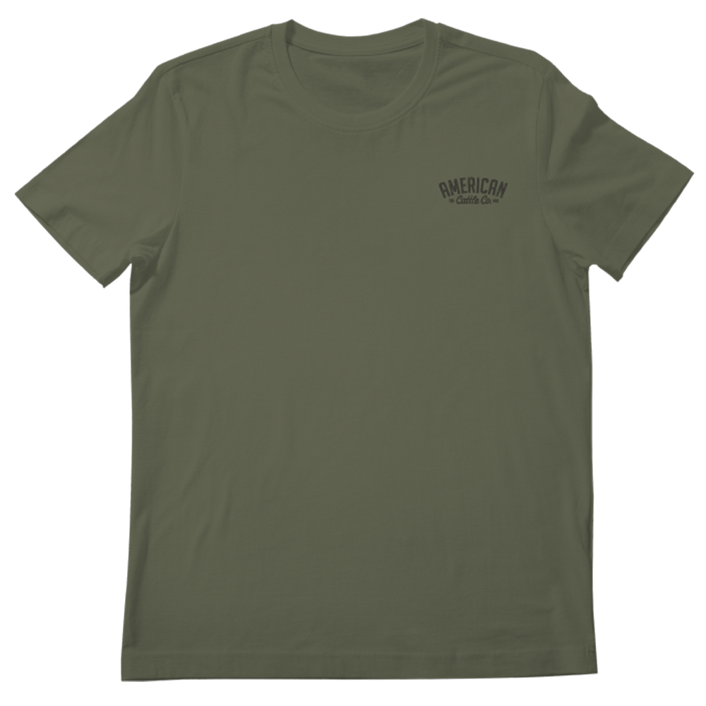 The Cactus Tee by Rural Cloth is a plain olive green t-shirt with short sleeves. It features a small, black "AMERICAN Coffee Co." logo on the upper left side of the chest and is displayed against a white background.