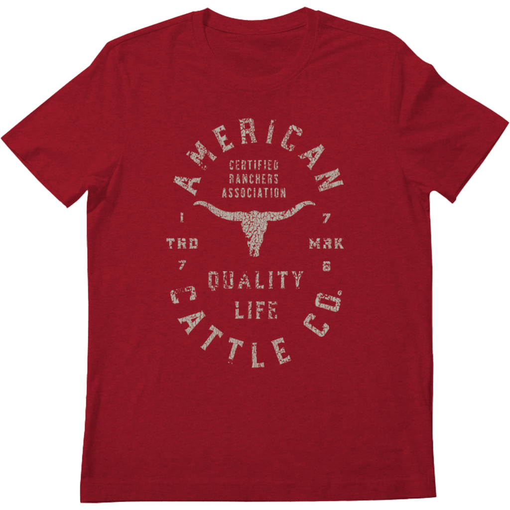 The Quality Tee by Rural Cloth is a red T-shirt that showcases a vintage-style design with white distressed text. The design reads 