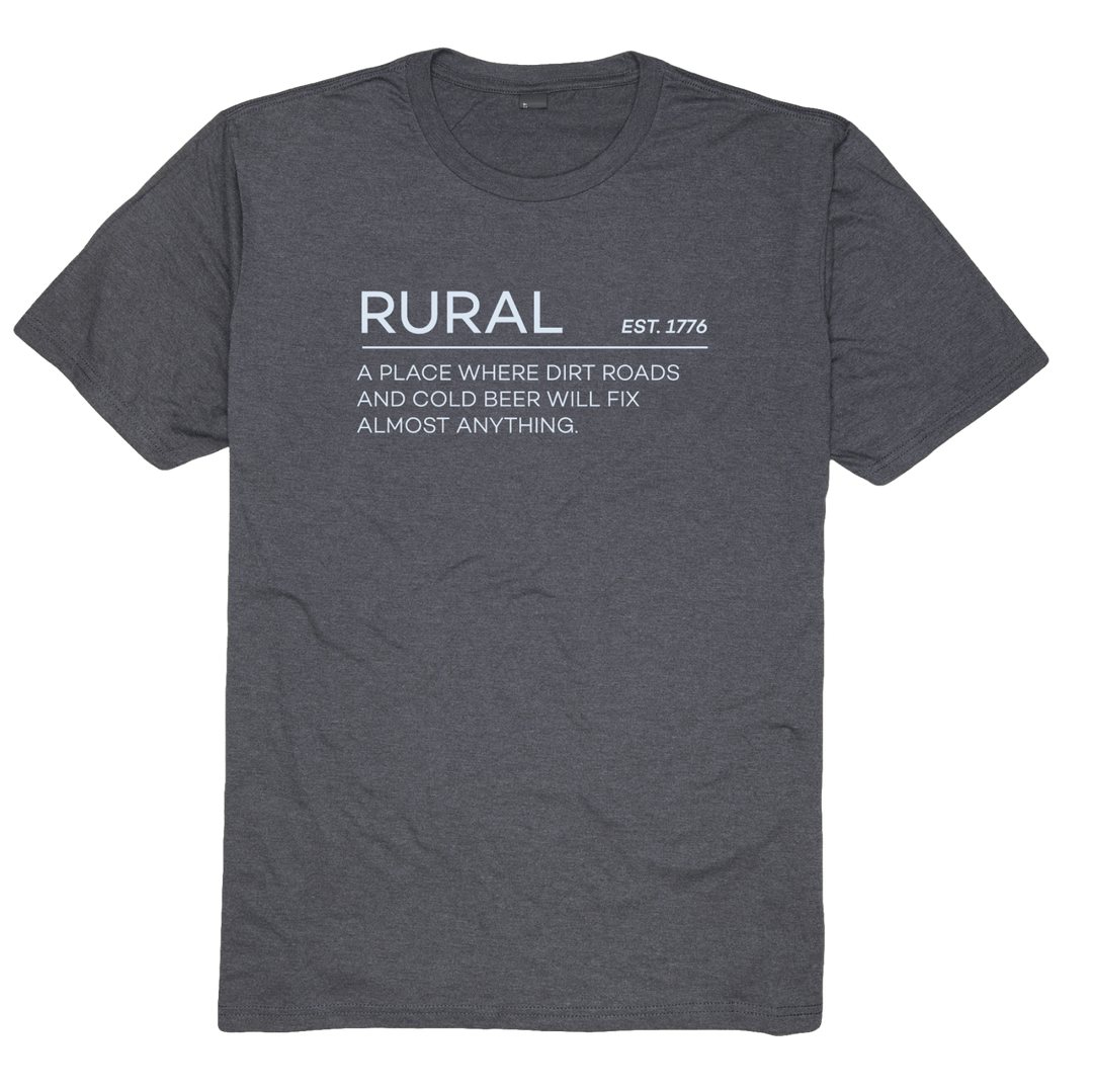 The Rural Cloth "Rural Def-Black Frost" is a dark gray t-shirt with white text that reads: “RURAL EST. 1776 A place where dirt roads and cold beer will fix almost anything.” This short-sleeved, crew neck shirt is perfect for those who love the countryside.
